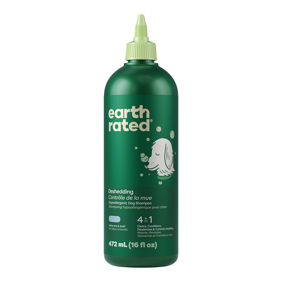 Green bottle of Earth Rated dog shampoo on a white background