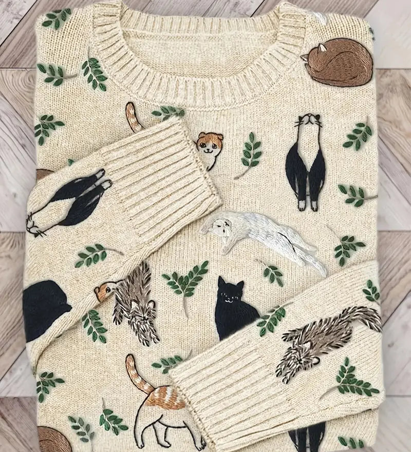 Folded sweater with animal pattern on a wooden surface