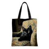 Black Cat on Floral Chair Tote Bag
