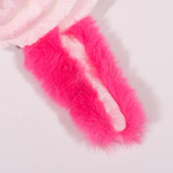 Close-up of pink and white fuzzy fabric on a light gray background
