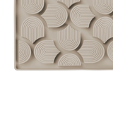 Beige silicone mold with geometric pattern on a white background