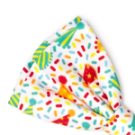A white ribbed fabric headband featuring a colorful confetti and party hat pattern, shown on a plain white background.