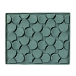 Green tray with geometric pattern on a white background