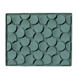 Green tray with geometric pattern on a white background