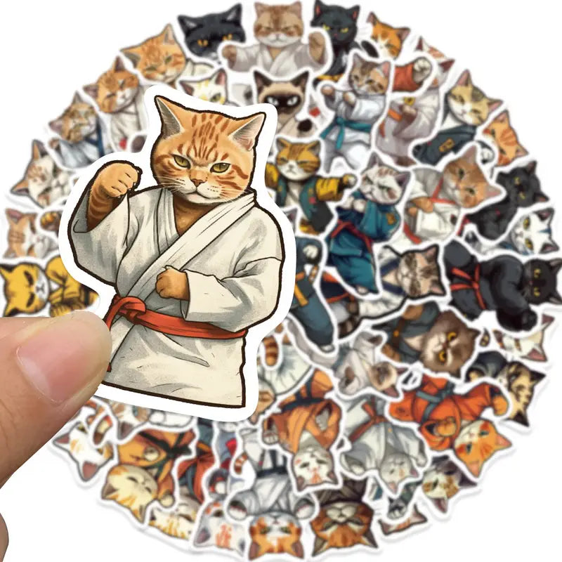 Collection of cat stickers with a focus on a cat in a karate outfit.