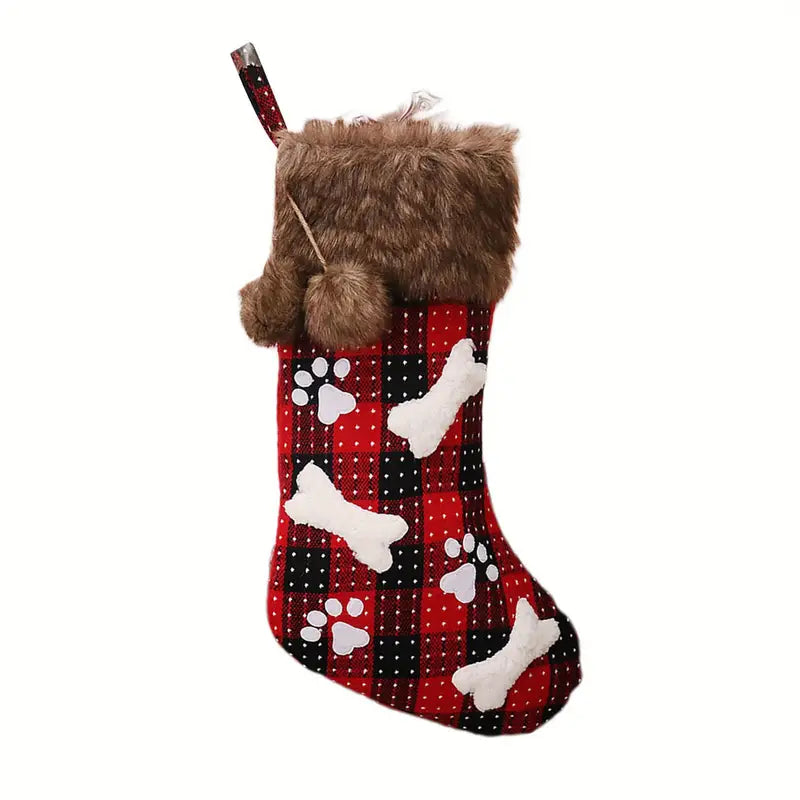 Dog-themed Christmas stocking with paw prints and a fluffy brown top on a white background