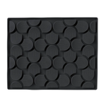 Black textured mat with geometric pattern on a white background