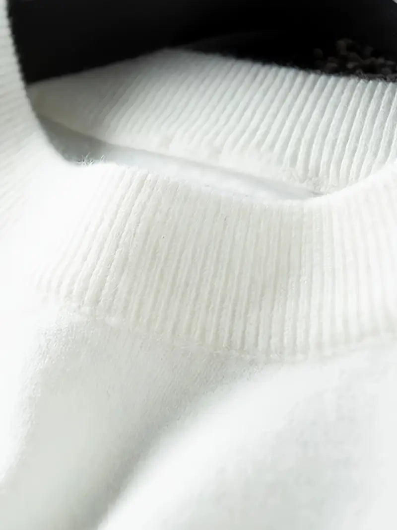 Close-up of a white textured fabric with a black border