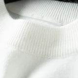 Close-up of a white textured fabric with a black border