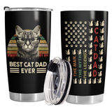 Two black tumblers with cat-themed designs on a white background