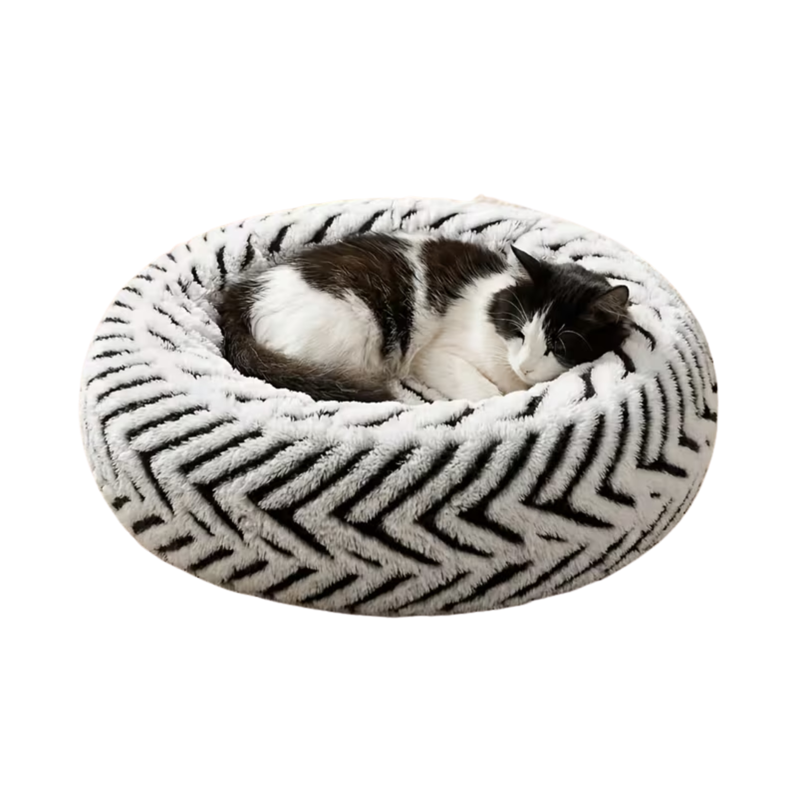 A plush round black and white pet bed with a black and white cat sleeping in the center.