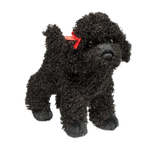 Black plush toy dog with a red bow on a white background