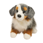 Plush toy dog with gray, brown, and white fur on a white background