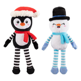 Plush toys of a penguin and a snowman with festive hats and scarves on a white background
