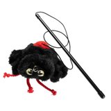 A black fuzzy spider-shaped plush toy with red yarn legs and a red top detail, shown with a long black wand-like rod and black cord on a plain white background.