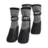 Set of gray pet socks with black soles and FPET branding on a light gray background
