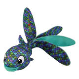 A colorful fish-shaped plush toy with a mermaid-scale pattern in purple, blue, green, and teal, featuring a smiling face and long tail, shown on a plain white background.