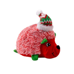 A plush hedgehog toy with red and white shaggy spines, a red face, green legs and ears, and a knitted red, green, and white Santa hat, shown on a plain white background.