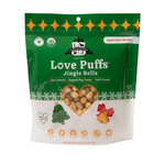 Green package of Love Puffs Jingle Bells dog treats on a white background