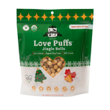 Green package of Love Puffs Jingle Bells dog treats on a white background