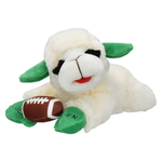 A plush sheep toy lying down and holding a small brown football. The sheep has a white body, green ears and feet, black eyes, and a red stitched mouth.