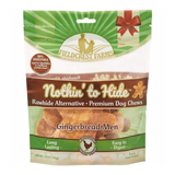A 4-pack bag of Fieldcrest Farms Nothin' to Hide Gingerbread Men rawhide alternative dog chews, in a green and white resealable stand-up pouch with a brown band and a photo of the gingerbread-shaped chews inside.