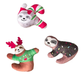 Three sloth toys with festive decorations on a white background
