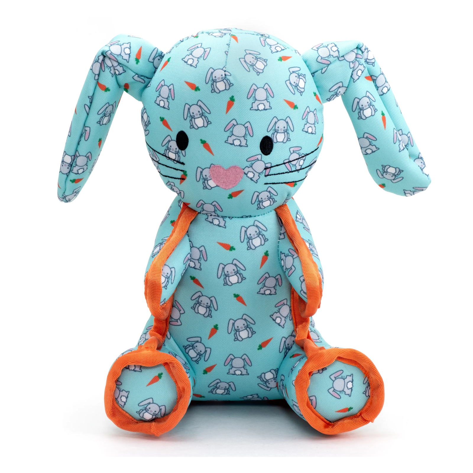 A plush stuffed bunny toy in light blue fabric with a repeating bunny-and-carrot print, orange trim, and black-and-pink embroidered facial details, photographed on a clean white background.