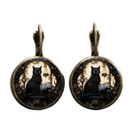 Pair of earrings with black cat design on a white background