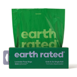 Green packaging of earth rated lavender poop bags with a roll on a white background
