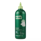 Green bottle of Earth Rated dog shampoo on a white background