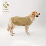 Dog wearing a beige sweater on a white background with 'Pets Tale' branding.