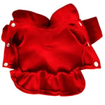 Red cloth diaper with snap closures on a white background