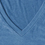 Close-up of a blue fabric with a V-neck design