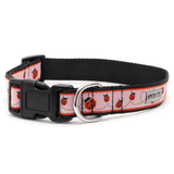 A black nylon dog collar with a pink and red ladybug pattern, featuring a black plastic buckle and a silver metal D-ring, shown on a white background.