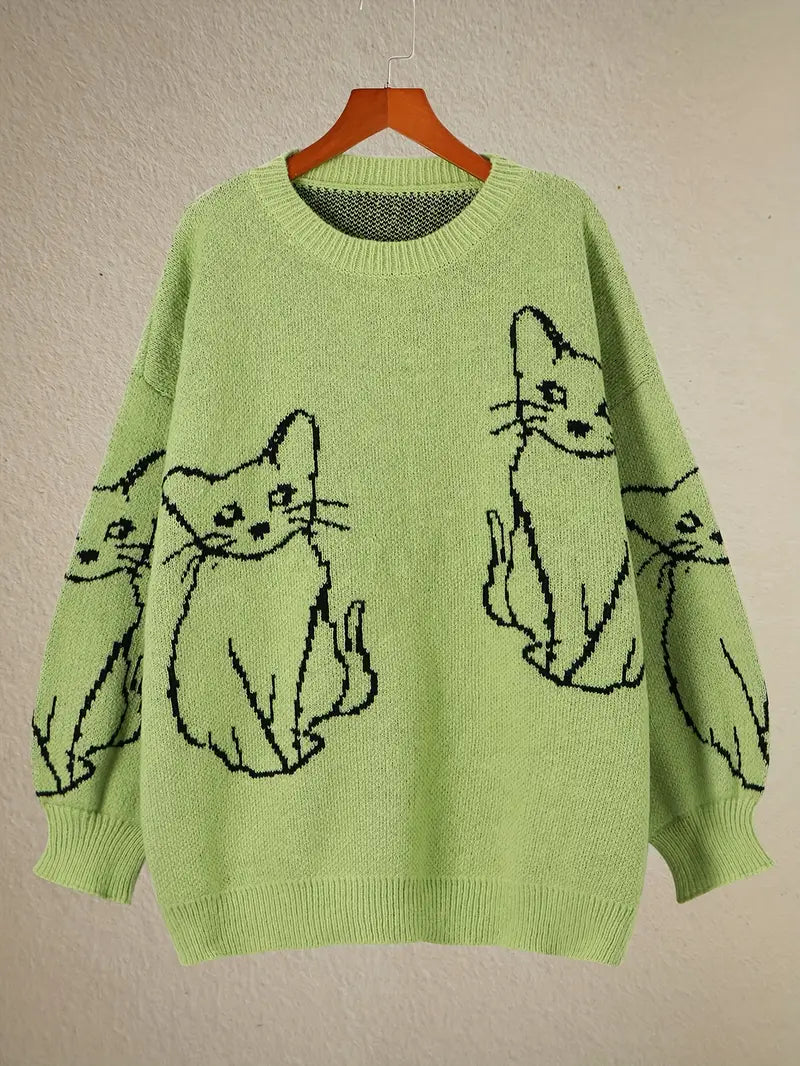 Green sweater with black cat illustrations on a beige background