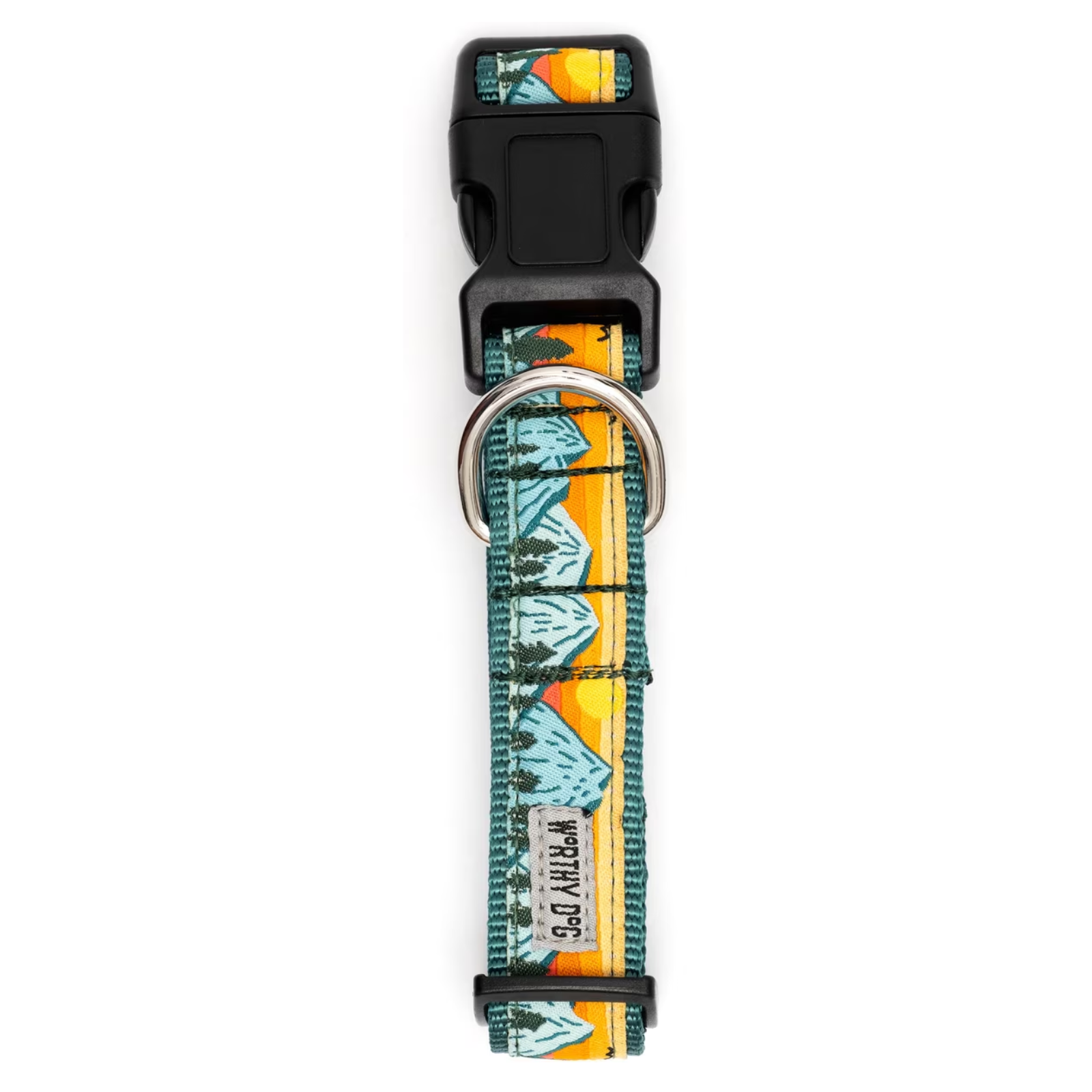 A dog collar with a colorful landscape print featuring mountains, trees, and a sunset, complete with a black plastic buckle and a silver metal D-ring. A small fabric label on the collar reads 'WORTH DOG'.