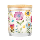 Candle with floral design and wooden lid on a white background