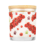 Candle with red berry design and wooden lid on a white background