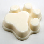 Beige paw-shaped mold on a white background