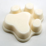 Beige paw-shaped mold on a white background