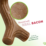 Dog chew treat flavored with real bacon on a light green background