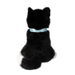 Black plush cat toy with a light blue ribbon on a white background