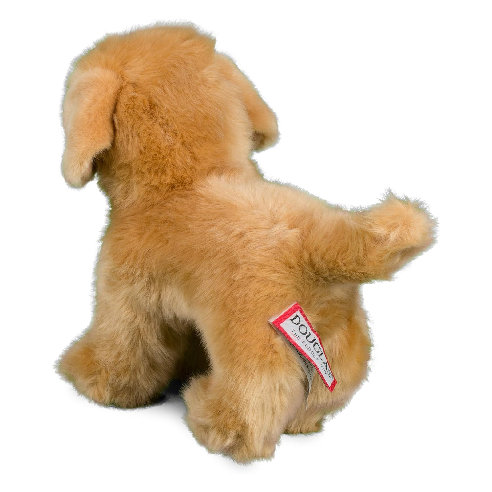 Plush dog toy with a visible brand label on a white background