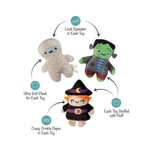 Three Halloween-themed plush toys arranged in a circle with callout text and icons describing features: a mummy plush labeled 'Ultra Soft Plush for Each Toy,' a Frankenstein plush labeled 'Loud Squeaker in Each Toy,' a witch plush labeled 'Crazy Crinkle Paper in Each Toy,' and all labeled 'Each Toy Stuffed with Fluff.'.