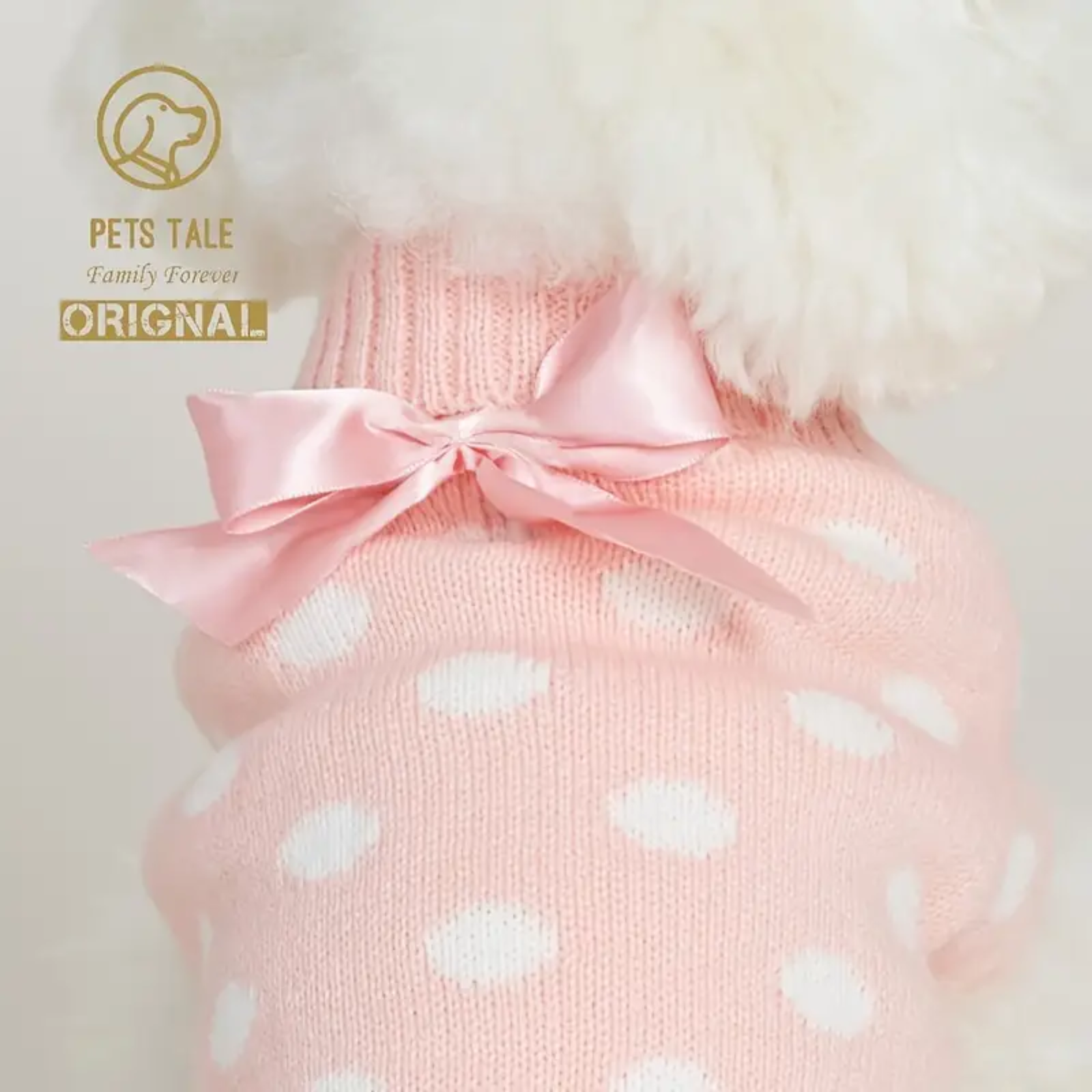 Pink polka dot pet sweater with a bow, branded 'Pets Tale'.
