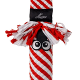 A red and white striped dog chew toy with a black top band, white and red tassel-like fringe, and embroidered cartoon eyes on a black mesh panel.