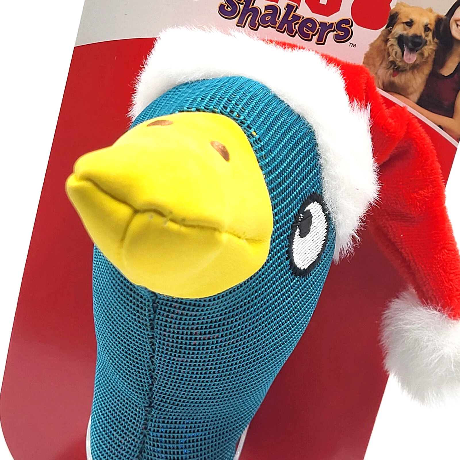Blue and yellow duck-shaped dog toy with a red background featuring a product box.