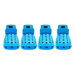 Four blue pet shoes with straps on a white background