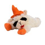 A plush toy sheep wearing an orange pointed witch hat, lying down on a plain white background.